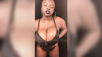 Slow motion BBW rubbing oil on big natural tits & body