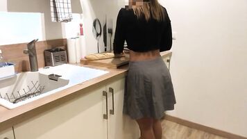 She cooks with a skirt that molds her big ass